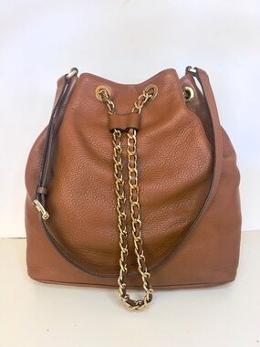 Michael Kors Pebbled Drawstring Bucket Shoulder Bag with Chain Detail in Cognac